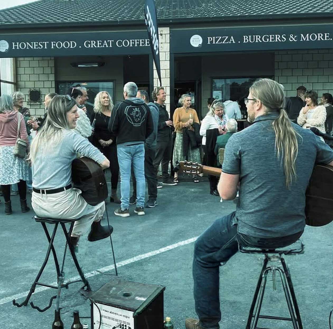 host your gathering at Smith & Local photo of a band playing outside with crowd of people celebrating